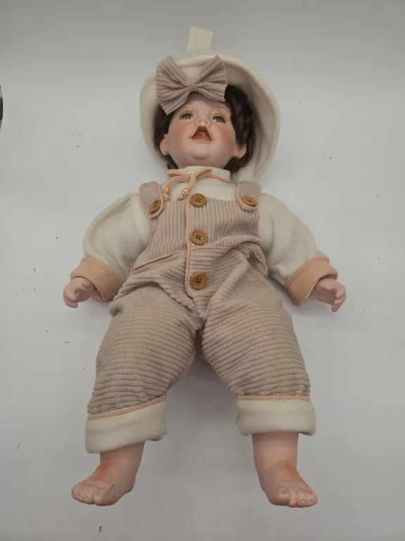 Vintage Madison Lee cloth bodied porcelain boy Doll.