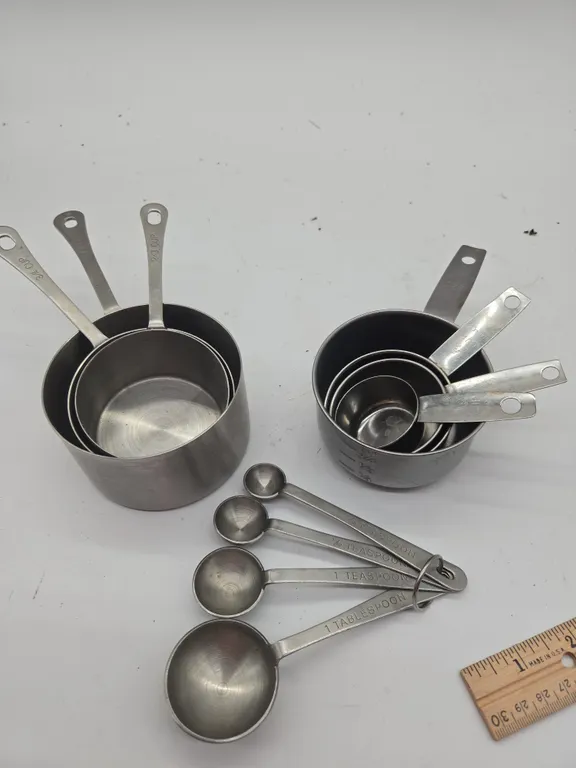 Assorted stainless steel measuring cups.