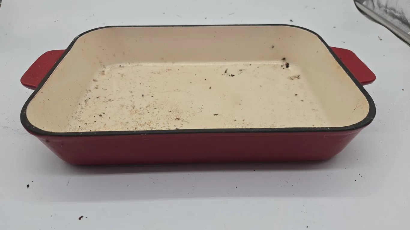 Vintage cast iron techniques, brand red enamel, baking dish.