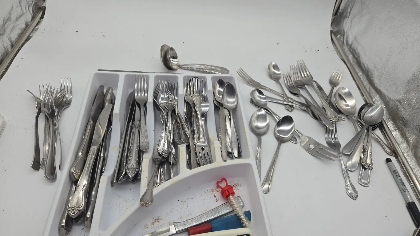 Large assortment of stainless steel flatwear.