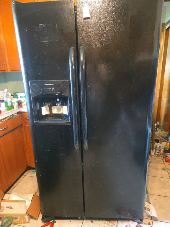Black frigidaire double door refrigerator.