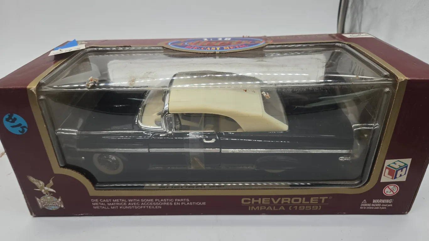 Vintage 1959 Chevrolet Impala dycast car in original box.