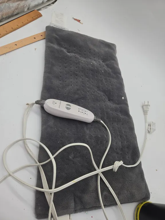 Sharper image calming heat massaging weighted heating pad