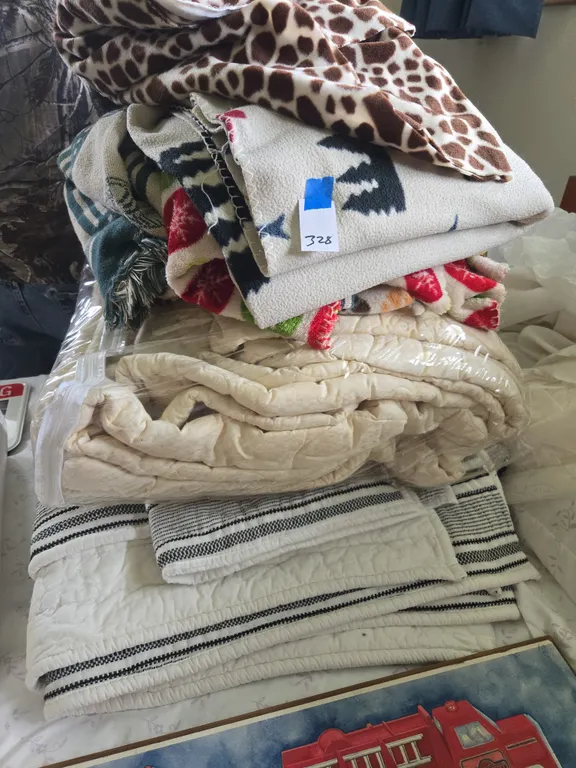 Assorted bed linens and blankets