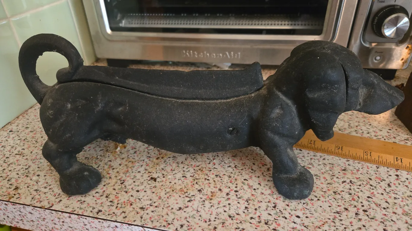 Vintage cast iron dashhound boot scraper