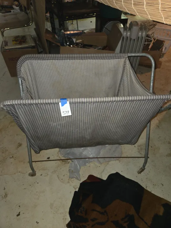 Vintage metal rolling laundry buggy