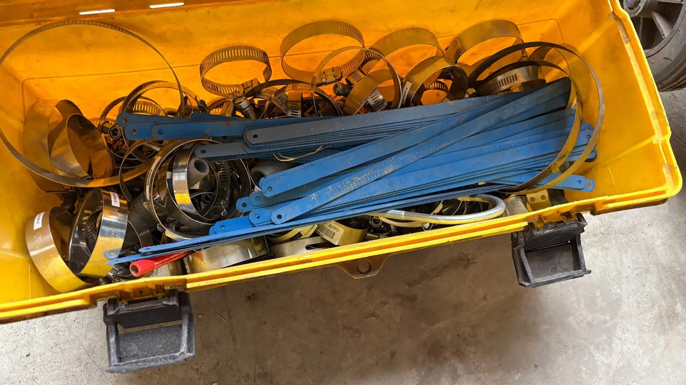 TOOL BOX CONTAING METAL CLAMPS AND BLADES