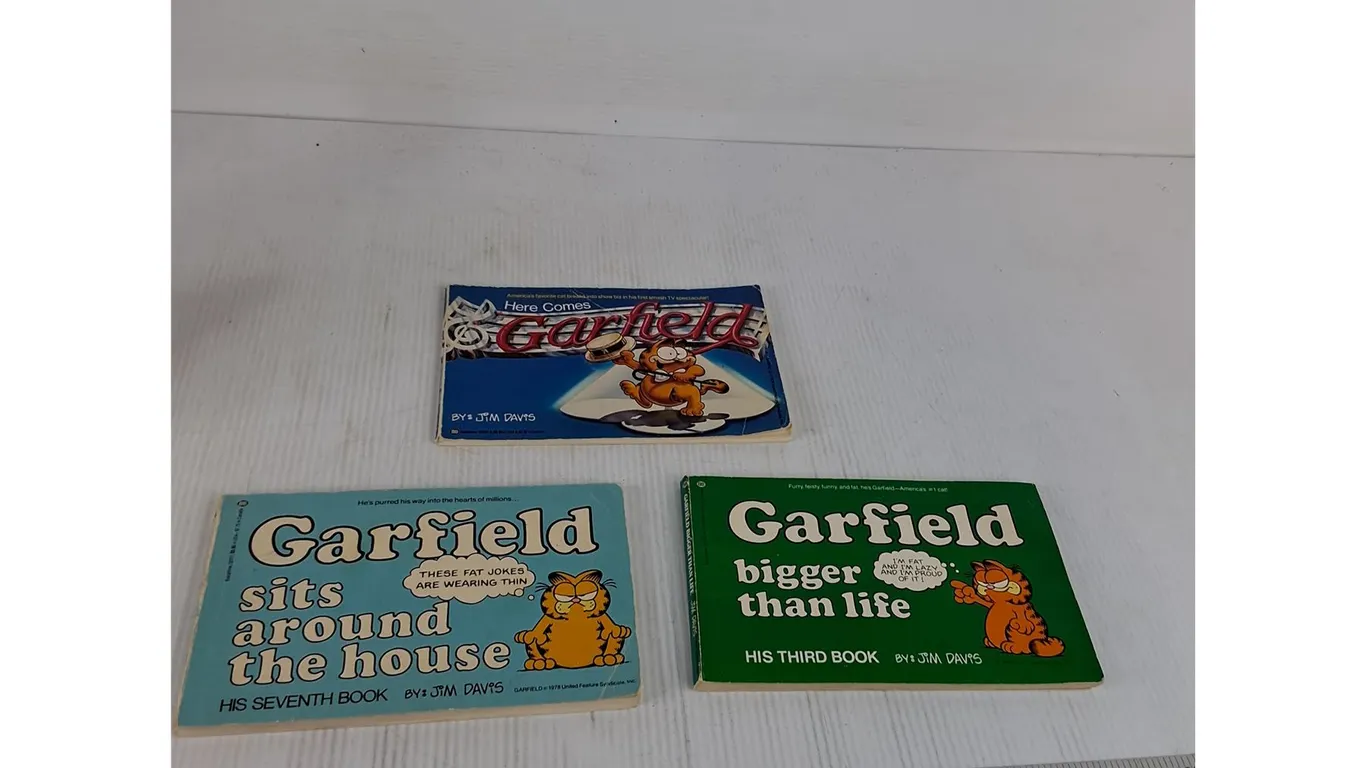 (3) Garfield Books- Here Comes Garfield, Garfield Sits Around The House, Garfield Bigger Than Life