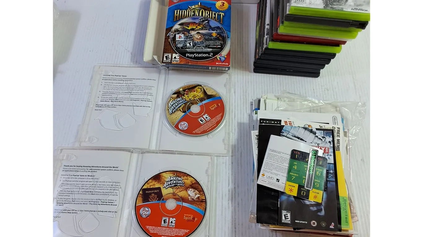 Amazing Adventures Game Discs, Assorted Game Manuals and Empty Game Cases