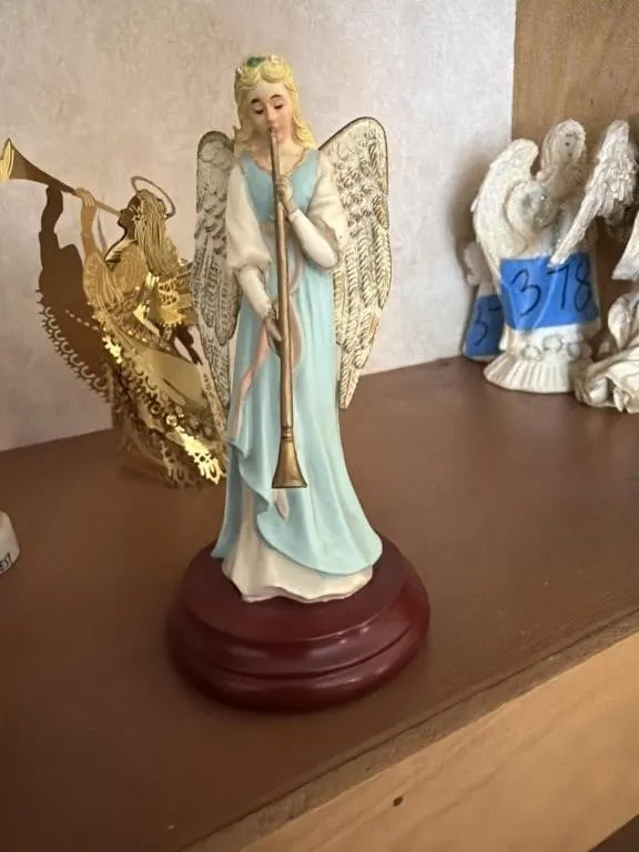 Small angel playing a trumpet