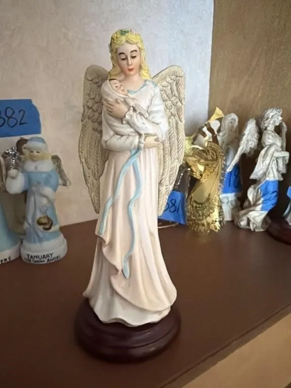 Angel holding a child