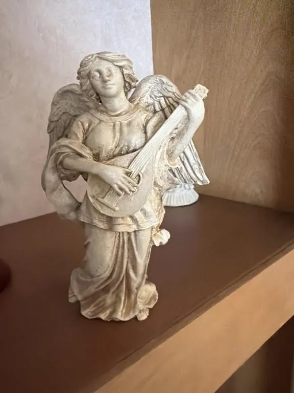 Angel playing a mandolin