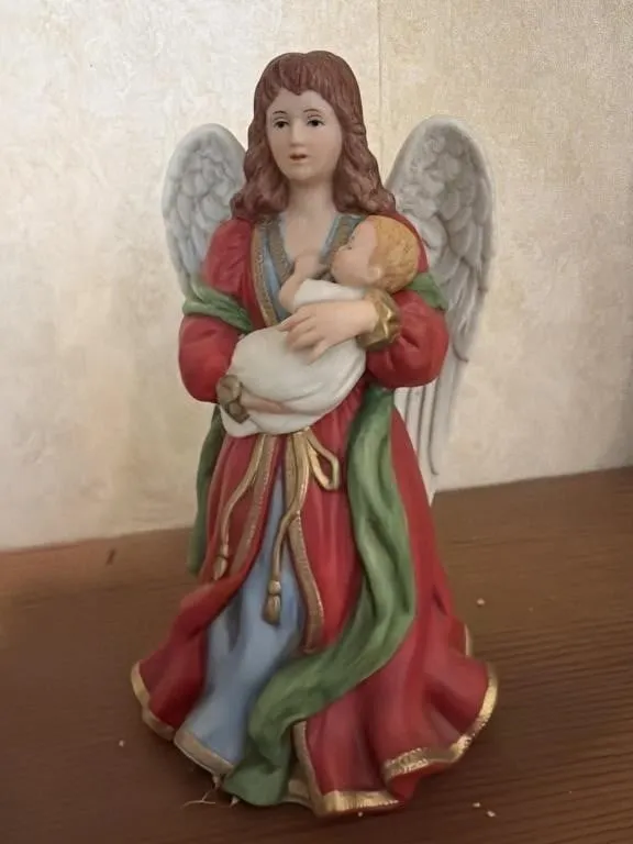 Angel holding a baby