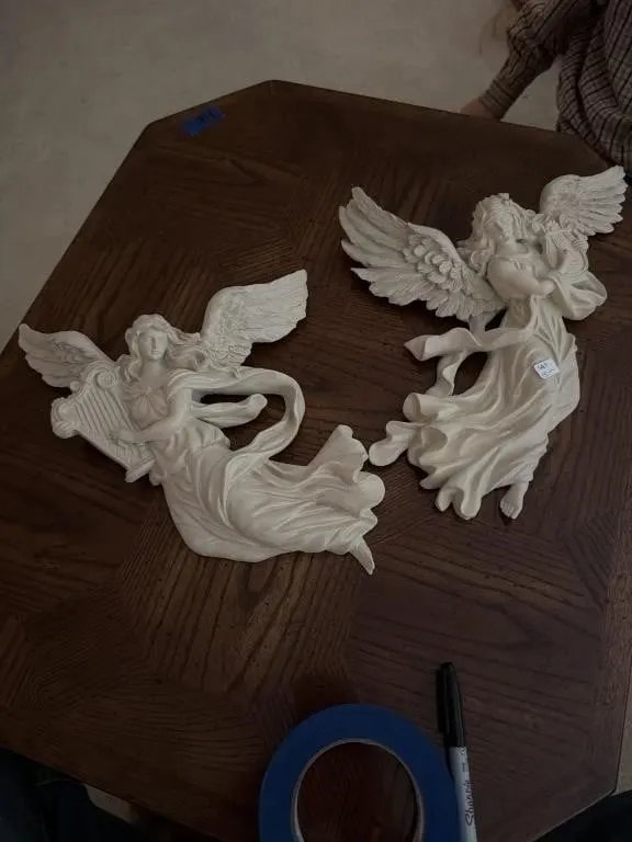 Two angel wall ornaments