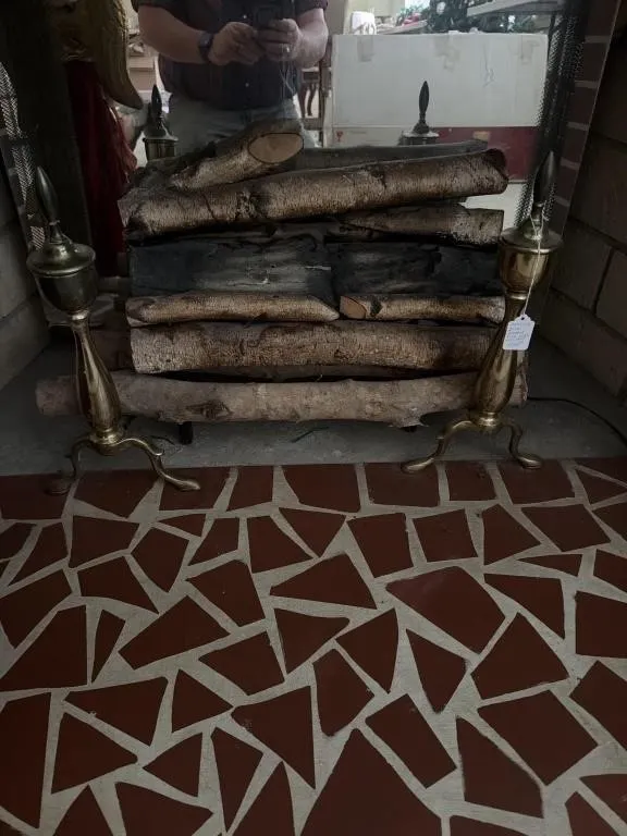 Brass log irons, electric fireplace logs, and
