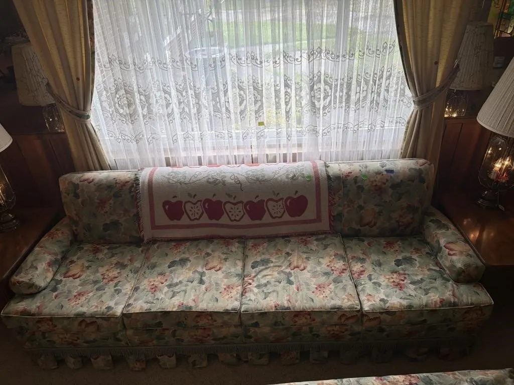 Large couch with large ottoman and throw