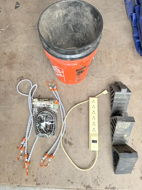 (3) Wheel Chucks, (8) Bungee Cords, (1) Outlet Strip