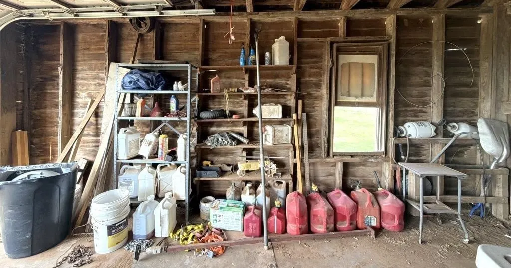 Rain Train Lawn Sprinkler, Metal Shelf, Gas Cans,