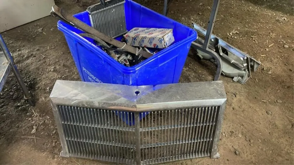 Automotive grill, light cover and bin of parts