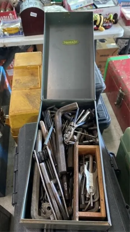 5.5x10.5x4in tall metal box with Allen keys