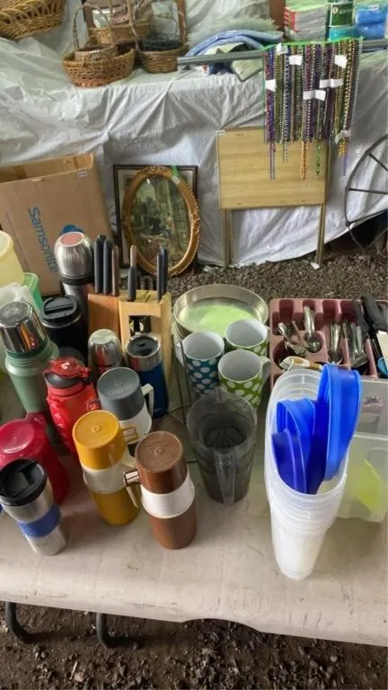 Assorted travel mugs, utensils, knives with block