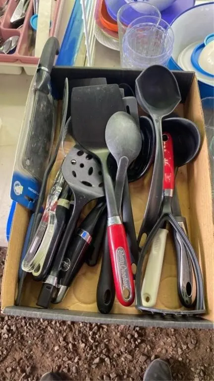 Assorted cooking utensils and new knife