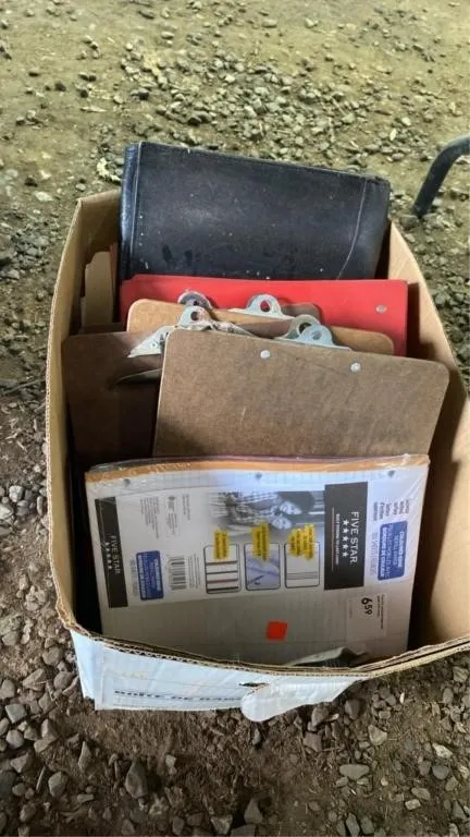 Box of paper, clip boards and binders