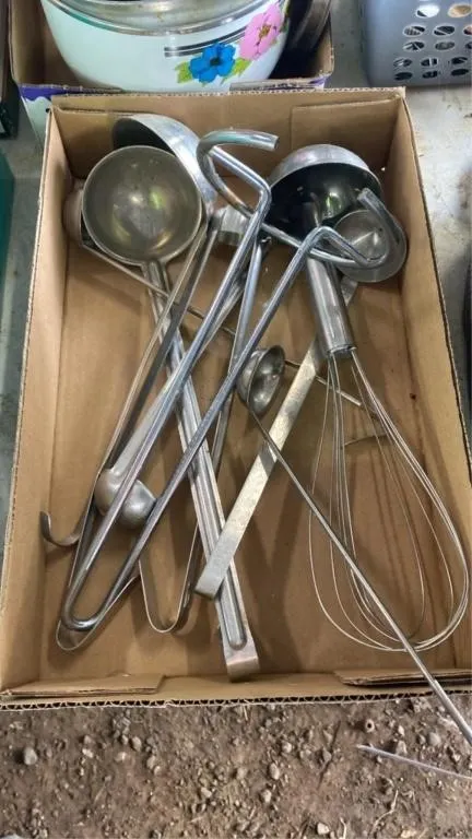 Assorted ladles, whisk and paper tower stand