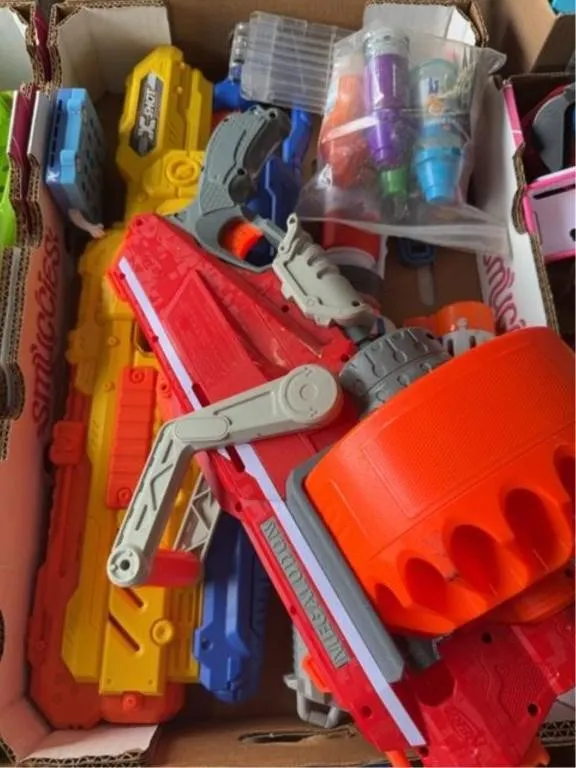 Collection of water guns and toys