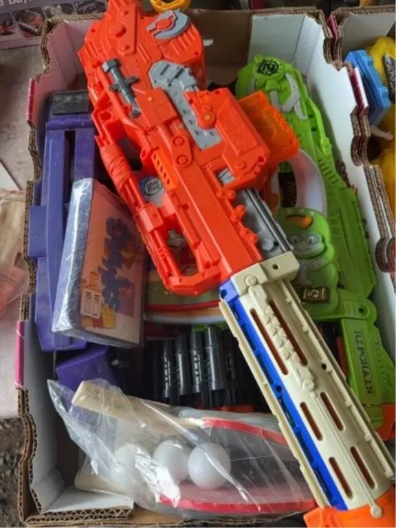 Bundle of water guns and toys