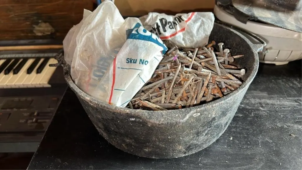 Cast iron pot full of nails