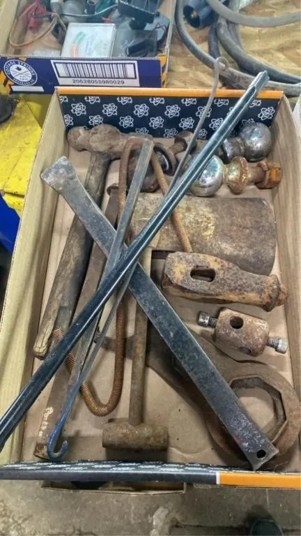 Trailer hitch balls, axe head, crow bar, hammer