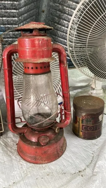 Vintage oil lamp and empty coffee tin