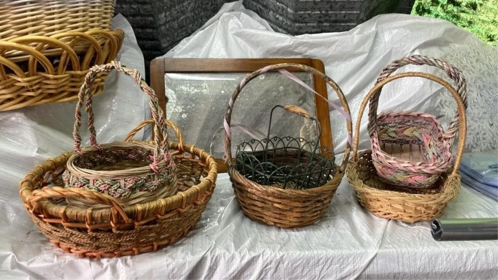Assorted small woven baskets and mirror