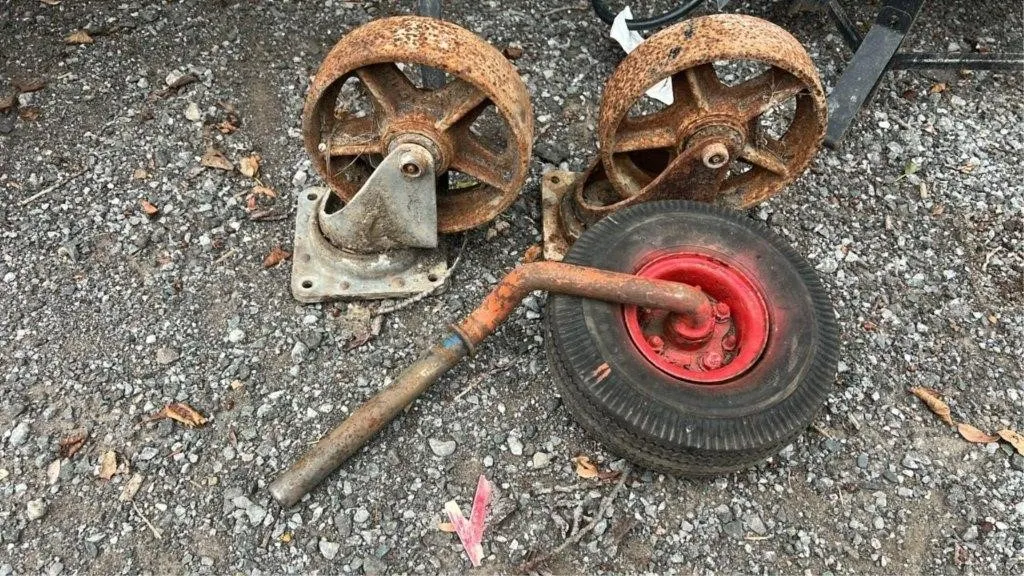 2 large cast iron casters and wheel