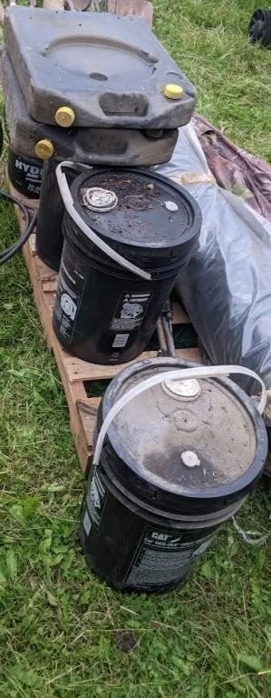 4 pails of 0W40, 0W20, gear oil, AW100, 2 drain ps