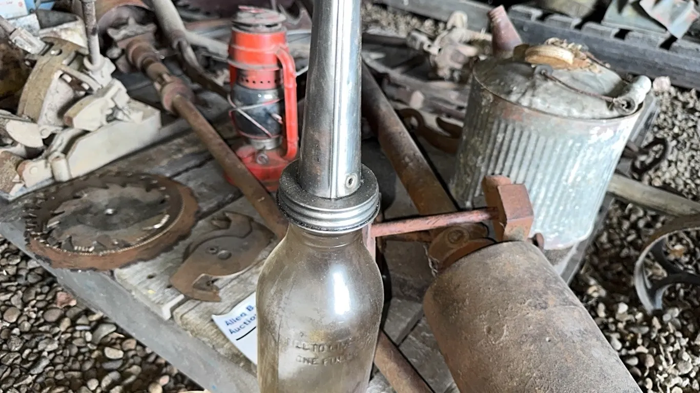 BUZZ SAW MANDRILL w/ 25" & 27" BLADES, BELT LACER, SERVICE STATION OIL JUG, LANTERN & MORE