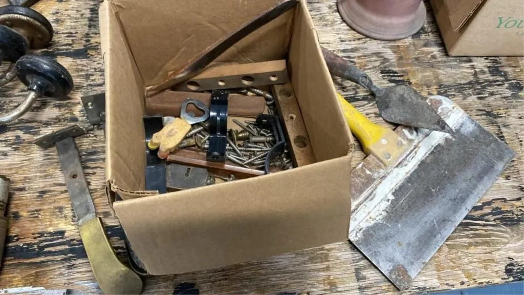 Assorted hardware, screws, drywall knife
