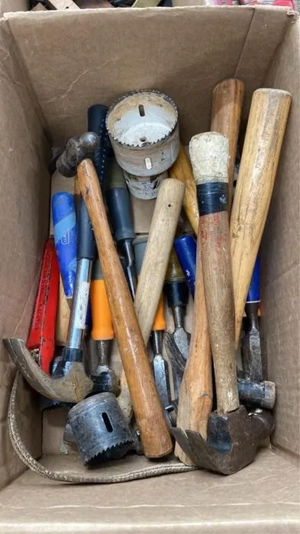 Box of hammers, chisels and hole saws