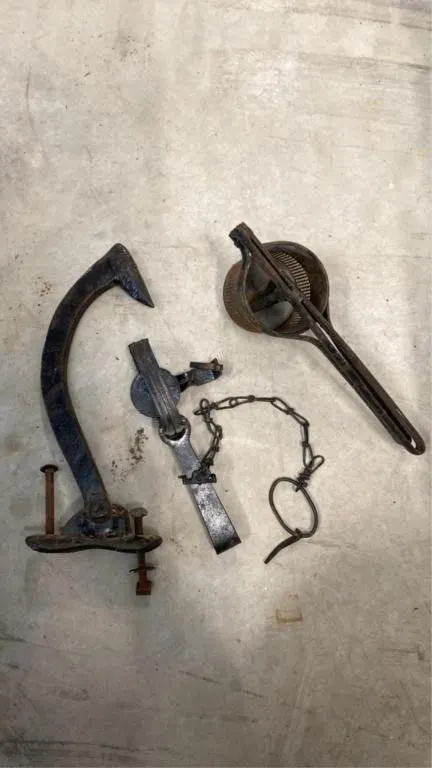 Antique animal trap, juicer, cant hook