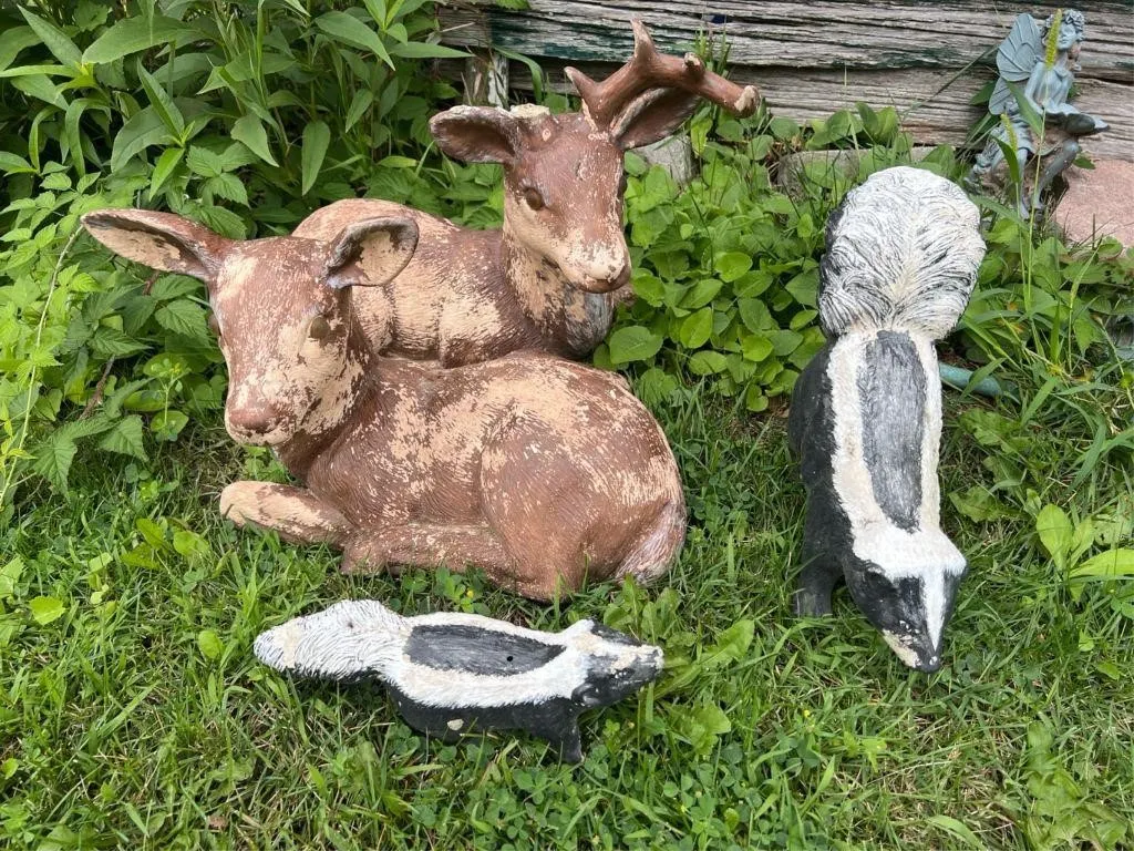 2 skunk and 2 doe garden decor