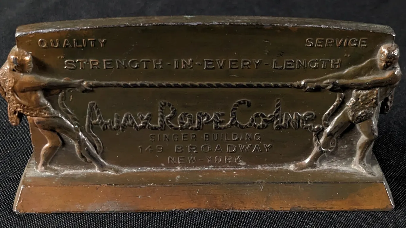 AJAX ROPE CO INC NEW YORK "TUG OF WAR" COUNTERTOP SIGN PAPER WEIGHT