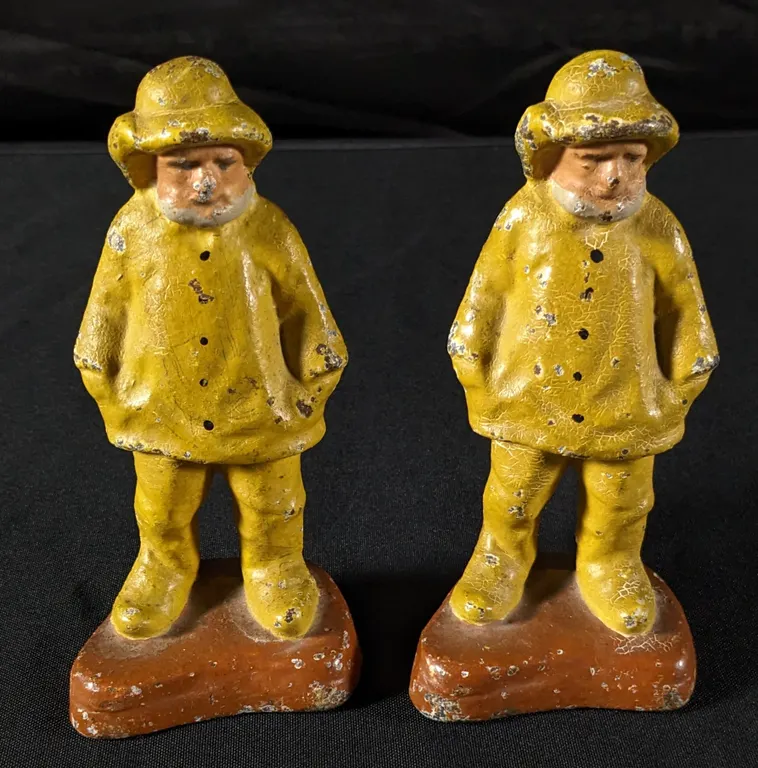 PAIR CAST IRON "OLD SALT" FISHERMAN YELLOW SLICKER BOOK ENDS OR DOOR STOPS