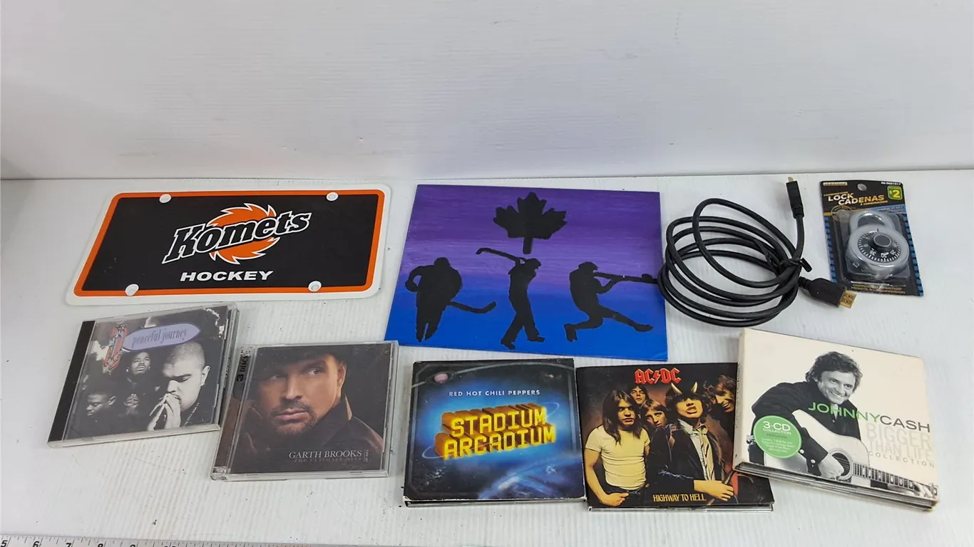 Komets Front Plate, Combination Lock, Audio CDs - AC/DC, Johnny Cash, Garth Brooks, HDMI Cable, Misc