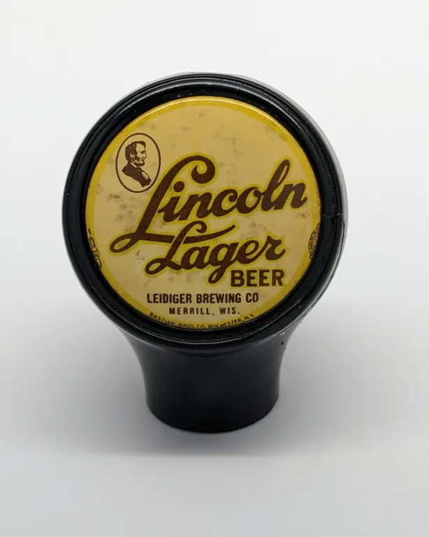 BALL TAP KNOB HANDLE LINCOLN LAGER BEER LEIDIGER BREWING MERRILL WISCONSIN (BASTIAN BROS)