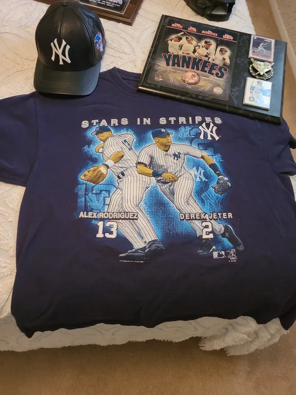 New York Yankees stars in stripes shirt, leather hat, and plaque