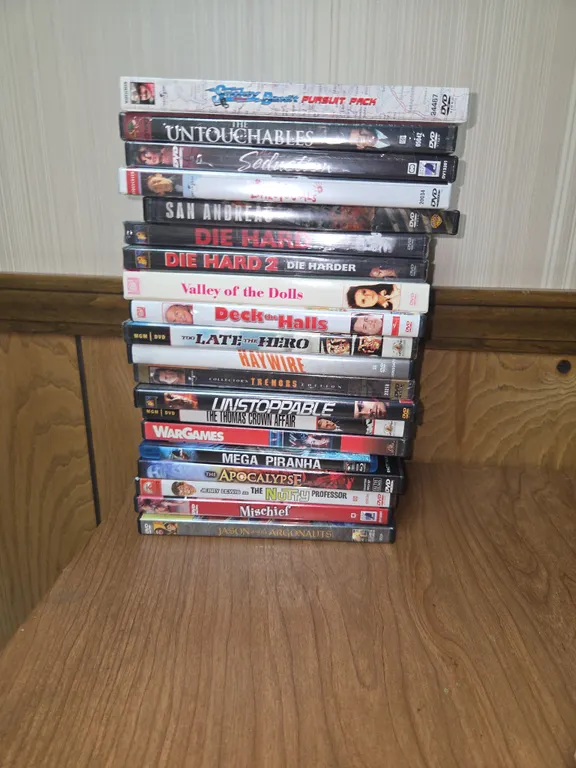 Large lot of action packed movies, including the apocalypse, the nutty professor valley of the dolls