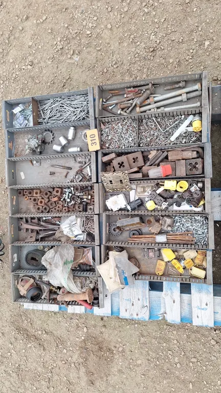 13 Metaql sorting trays with contents. Tap and die, swather guards and more