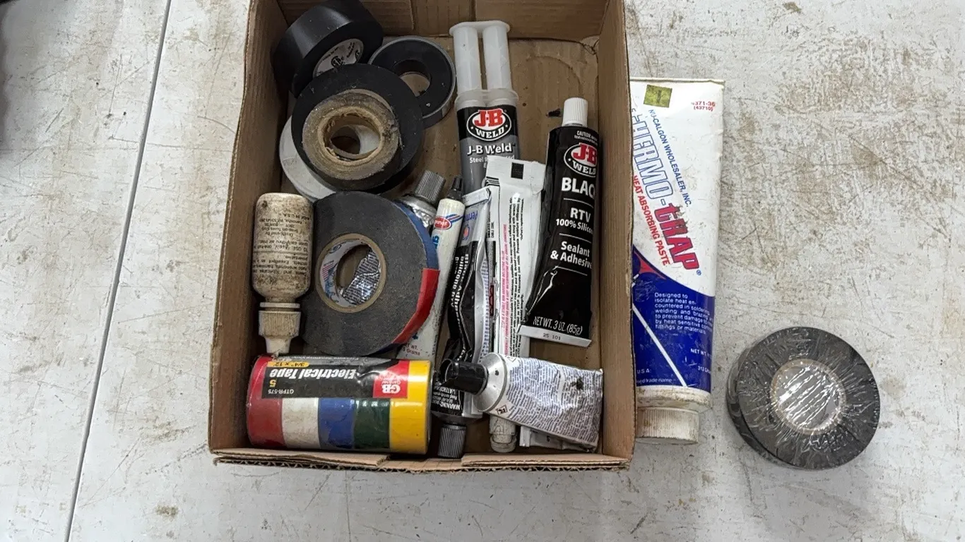 Insulating tape and adhesive