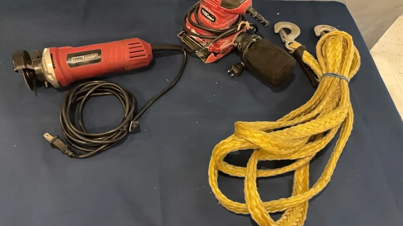 Sander, cut-off tool, and tow hooks
